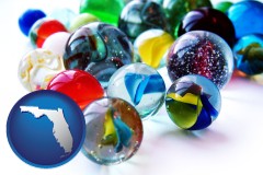 florida map icon and glass marbles