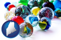 maine map icon and glass marbles