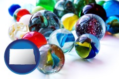 north-dakota map icon and glass marbles
