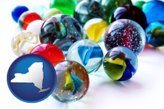 new-york map icon and glass marbles