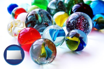 glass marbles - with North Dakota icon